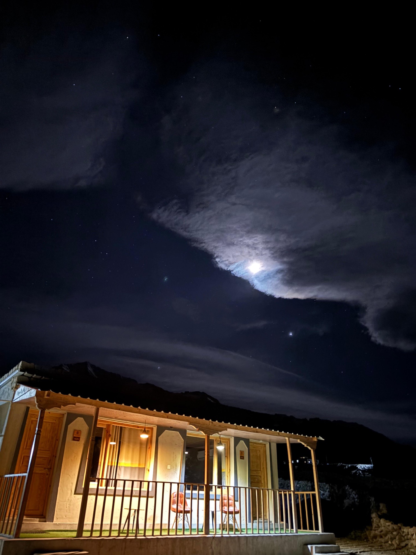 Guesthouse under moonlit starry sky in Ladakh